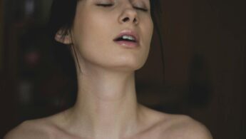 Topless Woman Closing Her Eyes