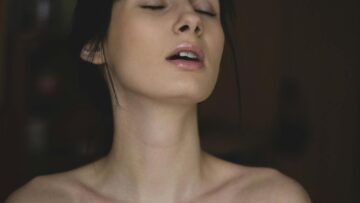 Topless Woman Closing Her Eyes